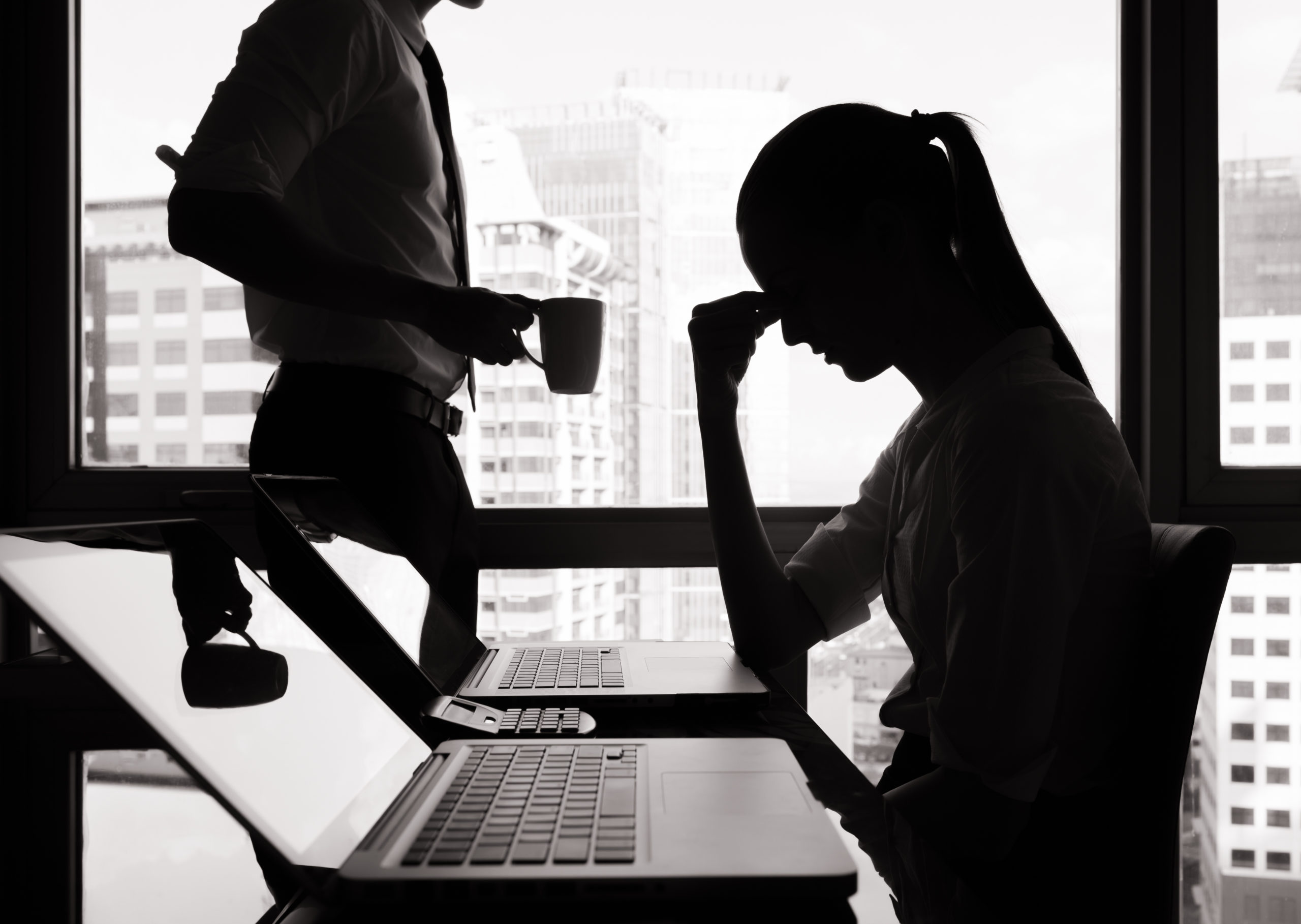 women stressed at her desk