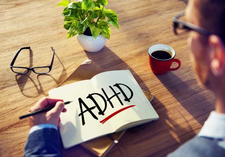 man thinking he has adhd with a cup of coffee