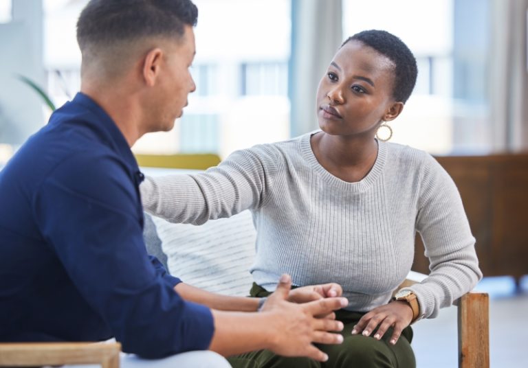 women trying to clam a man down due to overwhelming adhd