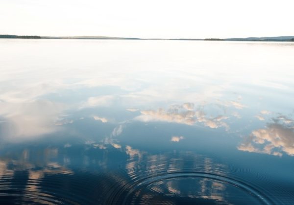 still-water-reflecting-sky-and-clouds-landscape